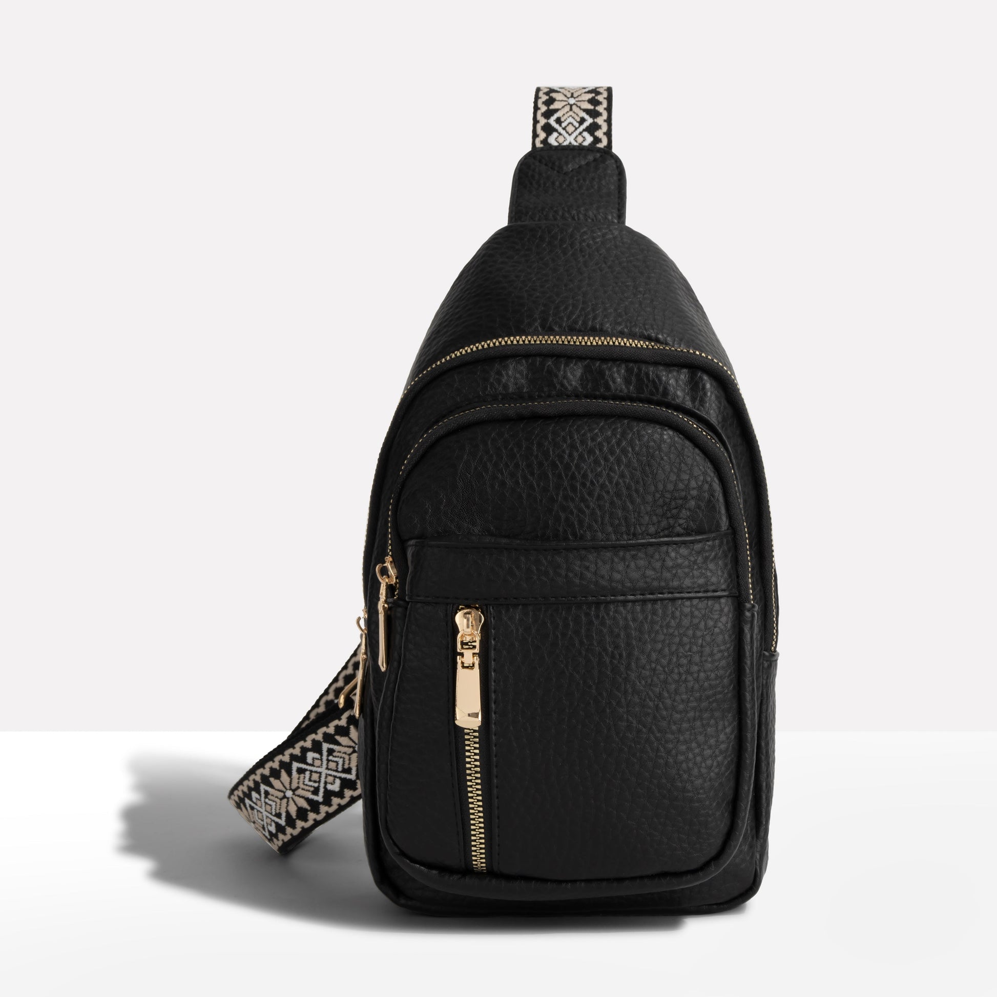 Women's Faux Leather Sling Bag with Patterned Strap and Gold-Tone Zippers